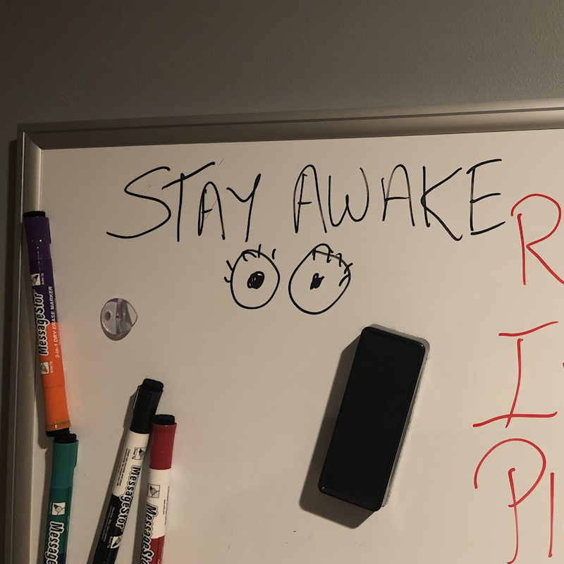 Photo: Stay Awake written on whiteboard